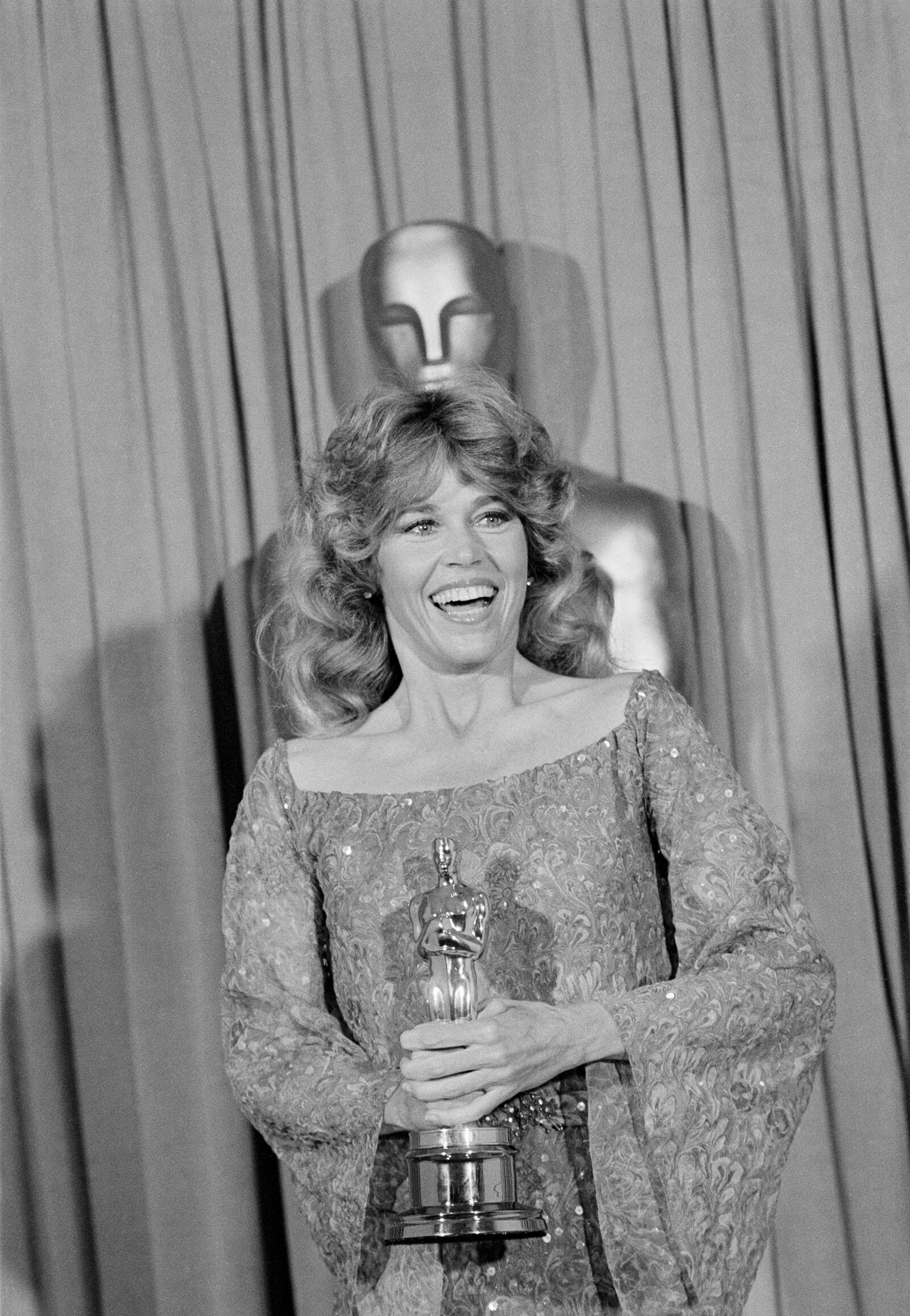 FILE - Jane Fonda poses with her Oscar at the 1978 Academy Awards on April 9, 1979, in Los Angeles. Fonda won the best actress award for her role in "Coming Home." (AP Photo/Lennox McLendon, File)