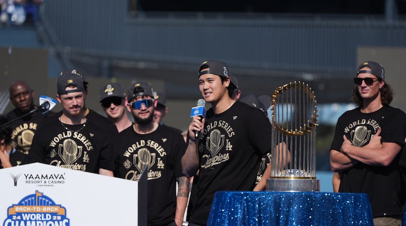 Los Angeles Dodgers' Shohei Ohtani speaks during a celebration of the baseball team's World Series win at Dodger Stadium on Monday, Nov. 3, 2025, in Los Angeles. (AP Photo/Gregory Bull)