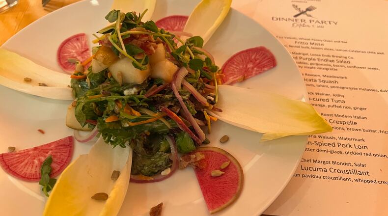 Chef Adrian Madrigal of Loose Ends Brewing Co. prepared this pear and purple endive salad for a Dayton Chefs United fundraiser. ALEXIS LARSEN/CONTRIBUTOR