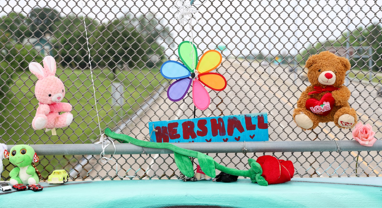 Hershall Creachbaum, who was 7 years old, was believed to be found dead Saturday. A 38-year-old Dayton man has been charged with tampering with evidence and gross abuse of a corpse. A memorial has been set up on the McClure Street bridge over U.S. 35. BRYANT BILLING / STAFF