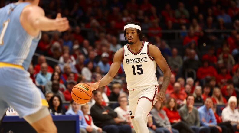 Dayton's DaRon Holmes II dribbles Cedarville in an exhibition game on Saturday, Oct. 28, 2023, at UD Arena. David Jablonski/Staff