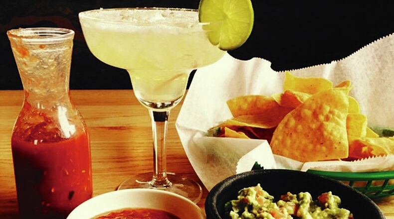Salsa, guacamole, chips and an ice cold margarita served up at Taqueria Mixteca’s Trotwood location. Photo by Alexis Larsen