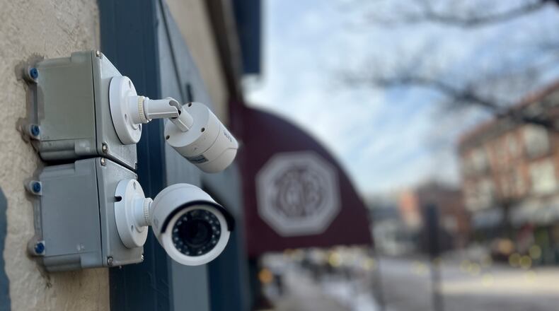 Security cameras outside of a restaurant in the Oregon District in Dayton. CORNELIUS FROLIK / STAFF