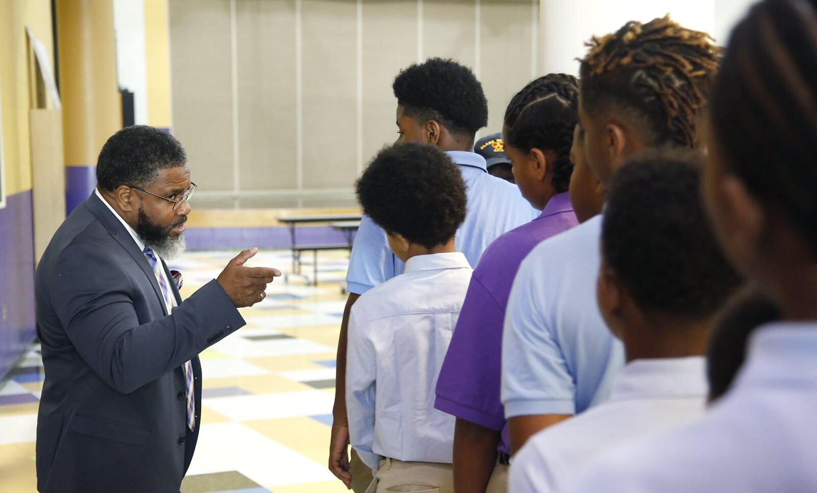 Dayton Boys Prep Academy Principal Therman Sampson II talks to students about school procedures. TY GREENLEES / STAFF
