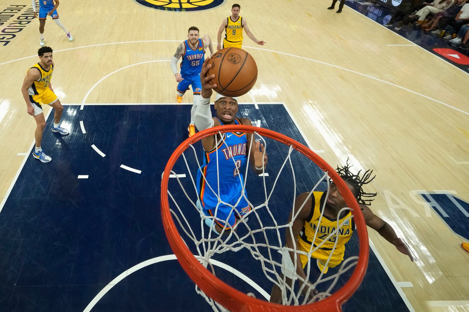 Oklahoma City Thunder forward Jalen Williams (8) shoots over Indiana Pacers forward Aaron Nesmith (23) during the first half of Game 3 of the NBA Finals basketball series, Wednesday, June 11, 2025, in Indianapolis. (AP Photo/Abbie Parr)