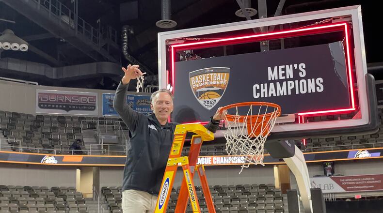 Wright State celebrates winning the 2022 Horizon League Tournament in Indianapolis. (Marcus Hartman/STAFF)