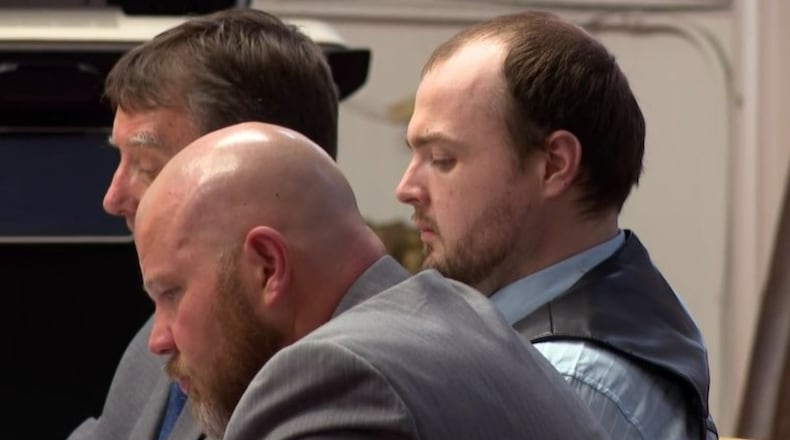 George Wagner IV is seen seated in the Pike County courtroom between his attorneys Oct. 3, 2022. Wagner faces charges of killing eight members of the Rhoden family in April 2016. CONTRIBUTED/WCPO