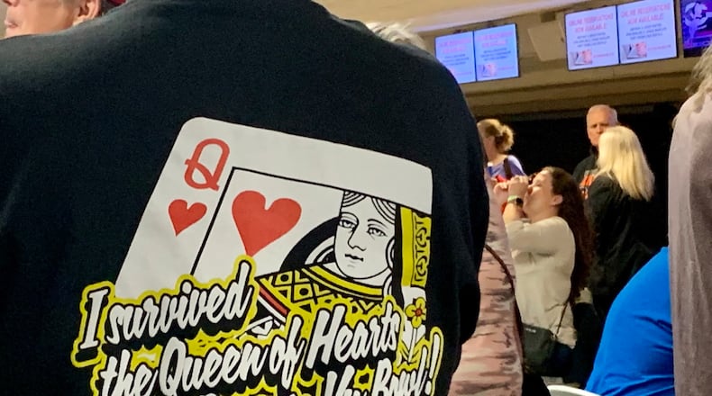 Staff members wore shirts that read "I survived the Queen of Hearts at Beaver-Vu Bowl!" for Monday's final game. The Beavercreek bowling alley was packed again Monday night for the final Queen of Hearts drawing. LONDON BISHOP/STAFF