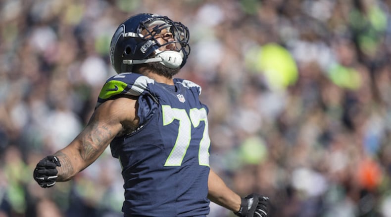 Seattle Seahawks' Michael Bennett exults after a tackle for loss during the first quarter on Sunday, Sept. 27, 2015, at CenturyLink Field in Seattle, Wash. (Dean Rutz/Seattle Times/TNS)