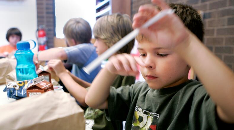 June 22, 2010. Children eat lunch at the Moraine Civic Center as they participate in the Summer Food Service Program.