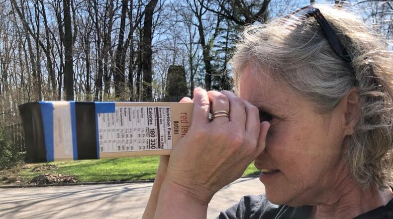 Paula Wilmot Kraus, Rosewood’s gallery coordinator, gives step by step instructions to create a camera obscura. CITY OF KETTERING