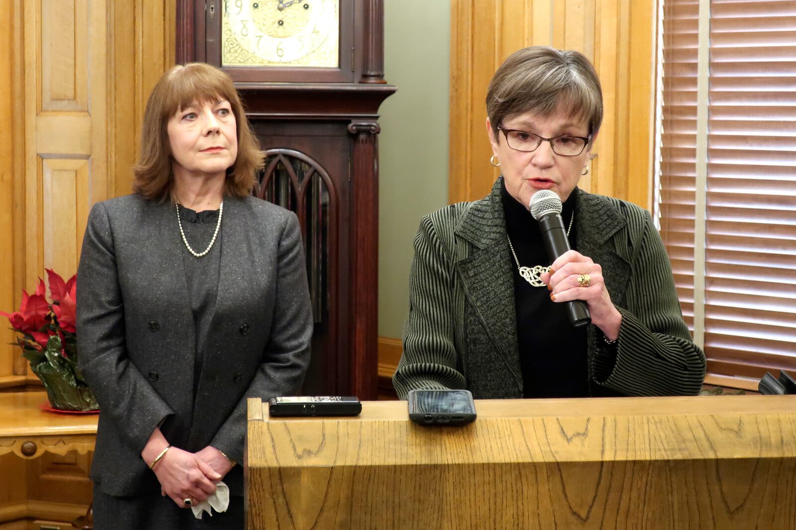 FILE - Shawnee County, Kansas District Judge Evelyn Wilson listens as Kansas Gov. Laura Kelly talks about Wilson's appointment to the Kansas Supreme Court during a news conference, Dec. 16, 2019, at the Statehouse in Topeka, Kansas. (AP Photo/John Hanna, File)