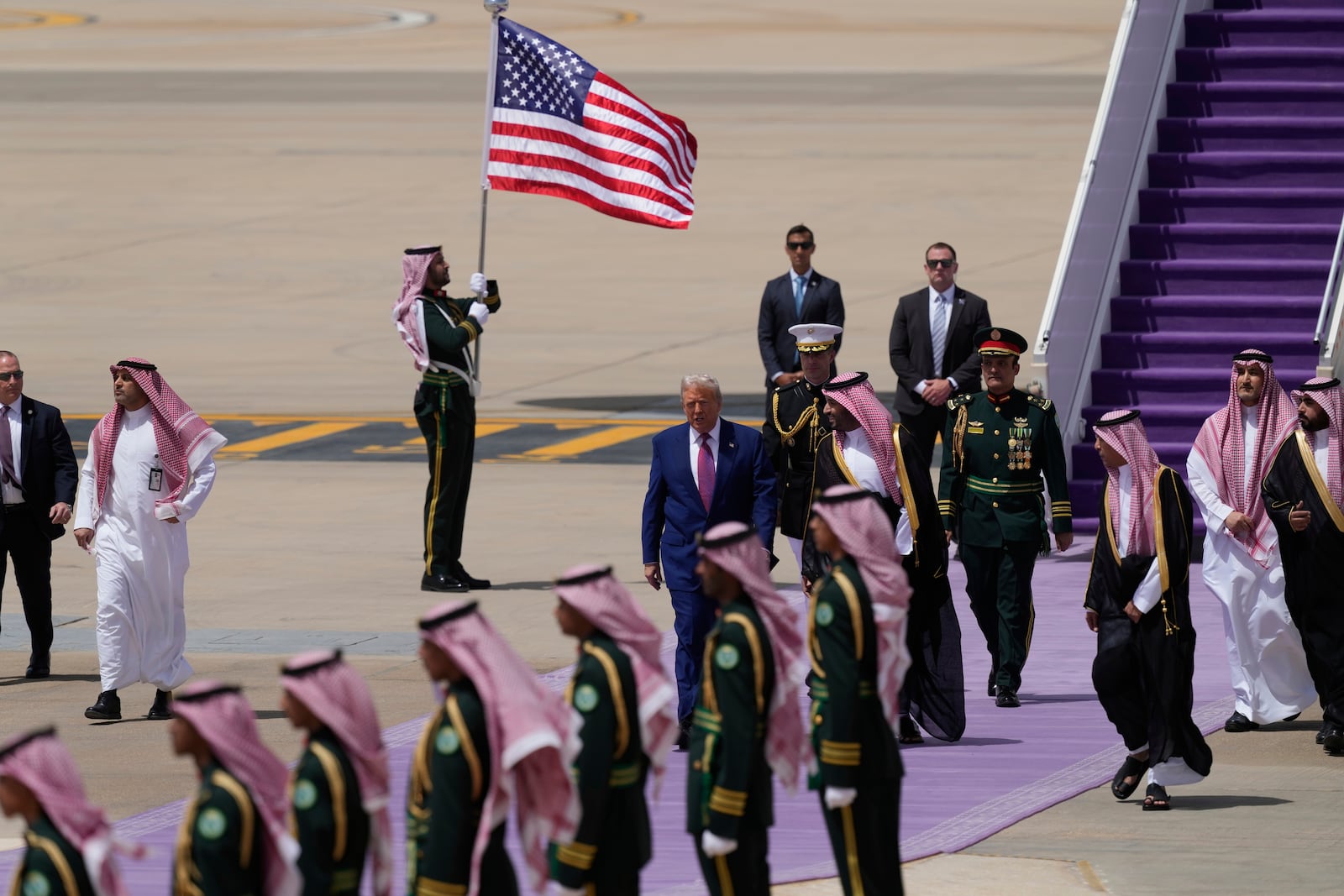 President Donald Trump speaks with Saudi Crown Prince Mohammed bin Salman during an arrival ceremony at the Royal Terminal of King Khalid International Airport in Riyadh, Saudi Arabia, Tuesday, May 13, 2025