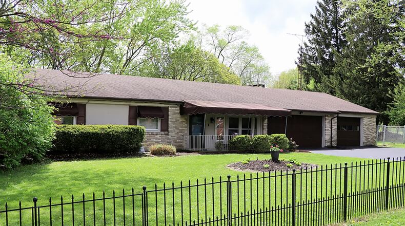 The 3-bedroom ranch home has about 1,635 sq. ft. of living space, plus the 3-season room. The half-acre lot has a fenced back yard with a spacious concrete patio, covered patio and in-ground swimming pool. There is also a 3-car garage. CONTRIBUTED PHOTO BY KATHY TYLER