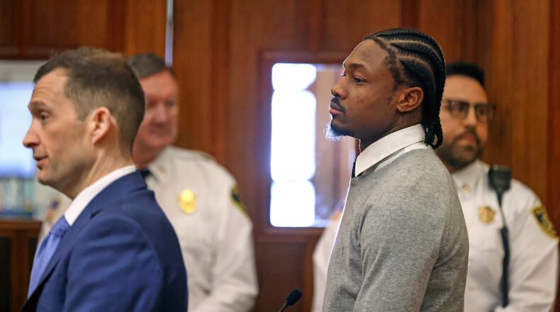 New England Patriots' Stefon Diggs, right, appears for his arraignment on felony strangulation and a misdemeanor assault charges, Friday, Feb. 13, 2026, at District Court in Dedham, Mass. (David L. Ryan/The Boston Globe via AP, Pool)