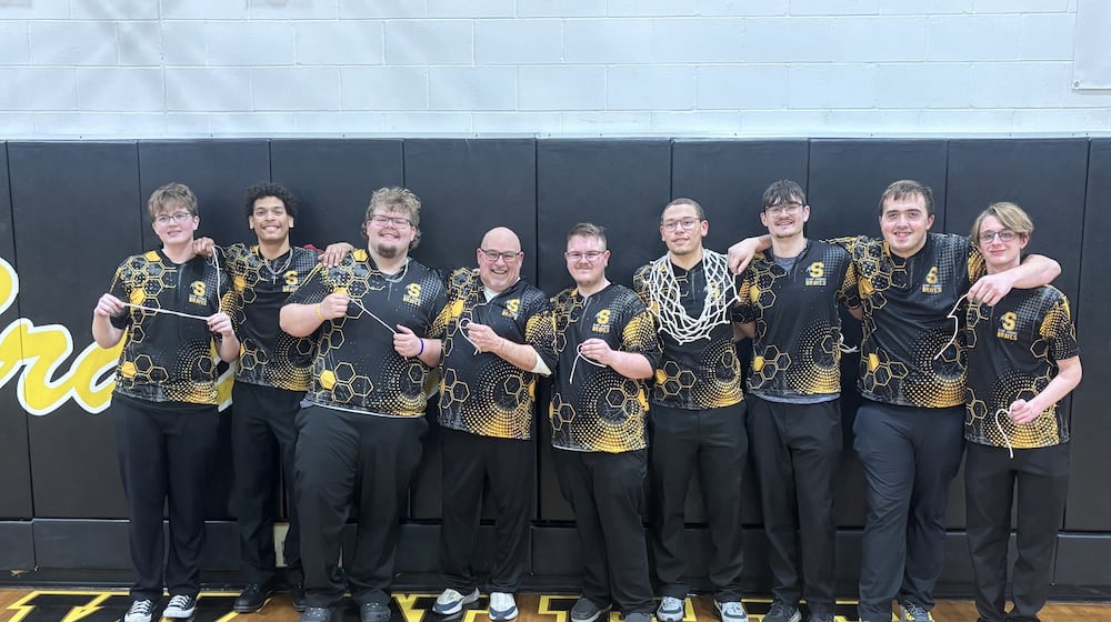 The Shawnee High School boys bowling team poses for a photo on Feb. 18, 2026 after cutting down the net in celebration of their fourth-place finish at the Division II district tournament, which qualified them for the state meet for the first time in school history. CONTRIBUTED PHOTO