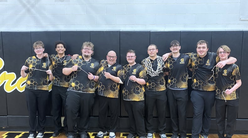 The Shawnee High School boys bowling team poses for a photo on Feb. 18, 2026 after cutting down the net in celebration of their fourth-place finish at the Division II district tournament, which qualified them for the state meet for the first time in school history. CONTRIBUTED PHOTO