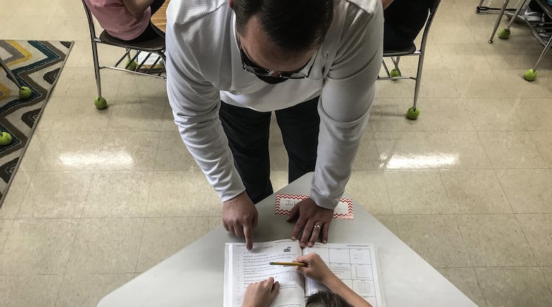 Orchard Park Elementary School math teacher Andy Ayres talks about fractions Tuesday March 2, 2021. Students are working hard in-person after months of COVID-19 restrictions.