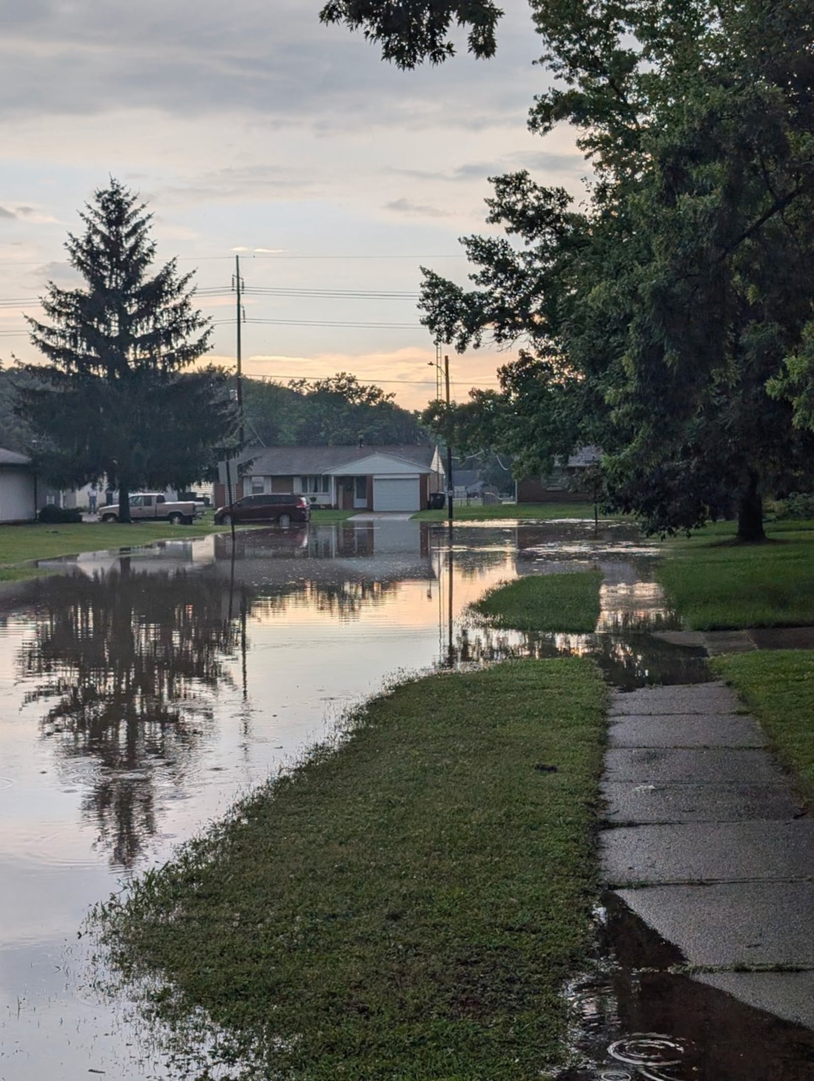 Flooding on Tulip Drive and E. Gibbons Road in West Carrollton Thursday, June 26, 2025. SHARYN BOYLE / STAFF