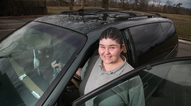 Dawn Roberts of Dayton was homeless for seven years. Now working full time, she uses her weekends and time off to transport and run errands for the underserved during the coronavirus pandemic. LISA POWELL / STAFF