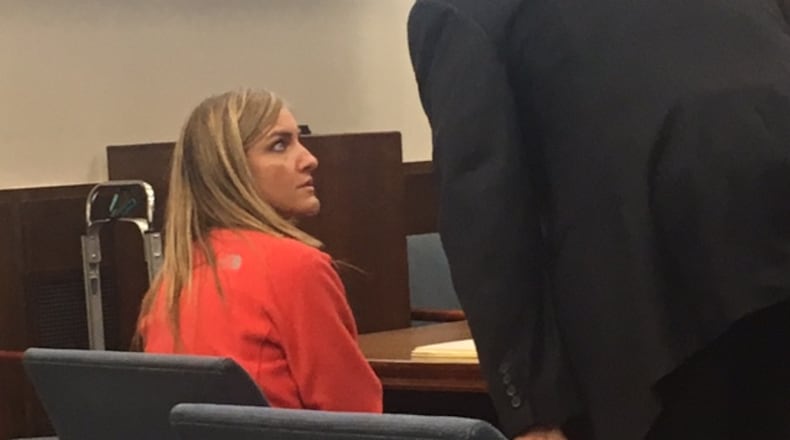 Ex-Miamisburg Middle School teacher Jessica Langford, 32, of Centerville, is on trial on charges alleging she had sexual contact with the student, who was 14. Langford is talking with her attorney Lawrence Greger. MIKE CAMPBELL/STAFF