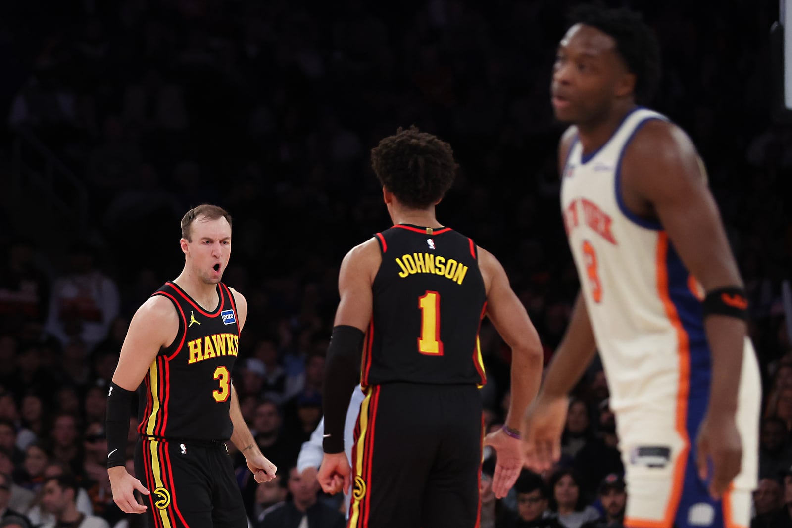 Atlanta Hawks guard Luke Kennard (3) and Jalen Johnson (1) celebrate during second half of an NBA basketball game against the New York Knicks, Friday, Jan. 2, 2026, in New York. (AP Photo/Heather Khalifa)