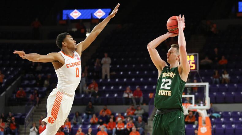 Wright State’s Parker Ernsthausen (22) tries to get a shot over Clemson’s Clyde Trapp (0) during Tuesday night’s NIT game at Littlejohn Coliseum in Clemson, S.C. Clemson won 75-69. PHOTO COURTESY OF CLEMSON ATHLETICS