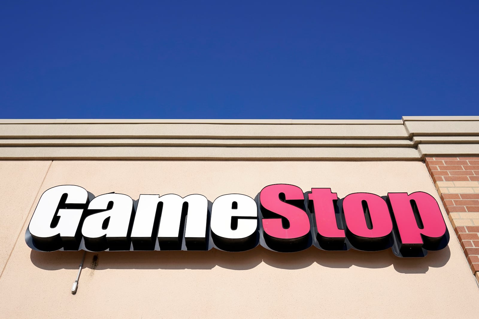 FILE - In this file photo, a GameStop sign is displayed above a store in Urbandale, Iowa, on Jan. 28, 2021. (AP Photo/Charlie Neibergall, File)