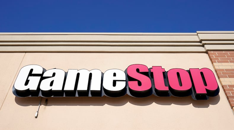 FILE - In this file photo, a GameStop sign is displayed above a store in Urbandale, Iowa, on Jan. 28, 2021. (AP Photo/Charlie Neibergall, File)