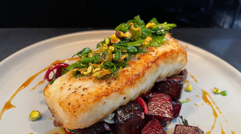 Corner Kitchen is located at 613 E. Fifth St. in Dayton’s Oregon District. Pictured is a Sea Bass dish they rolled out during winter restaurant week. NATALIE JONES/STAFF