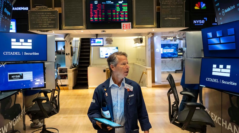 Traders works on the floor of the New York Stock Exchange, Friday, Aug. 1, 2025, in New York. (AP Photo/Yuki Iwamura)