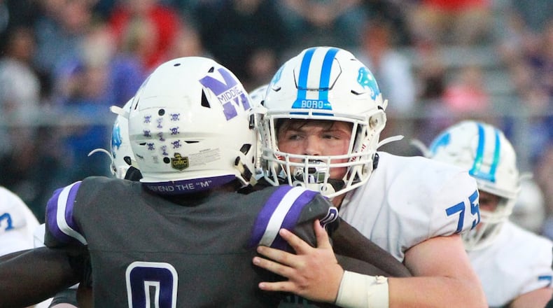Austin Rider of Springboro (right) takes on Middletown defender Cheik Fall. Springboro defeated host Middletown 37-14 in a Week 2 high school football game at Barnitz Stadium on Friday, Sept. 6, 2019. MARC PENDLETON / STAFF