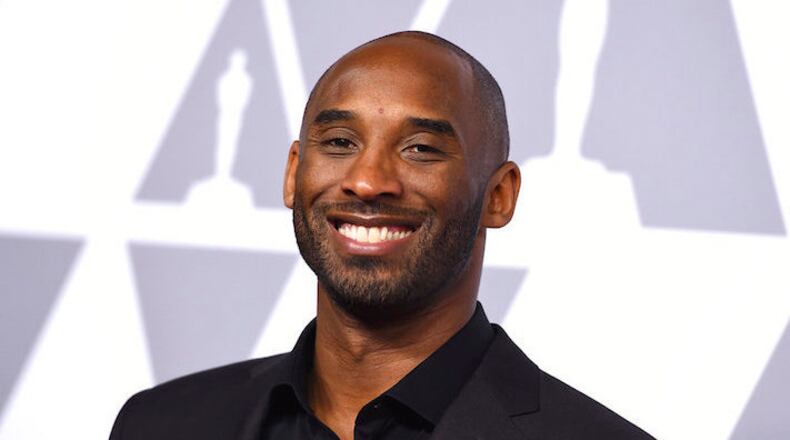 Kobe Bryant arrives at a luncheon for Oscar nominees in The Beverly Hilton on Money February 5, 2018 in Beverly Hills, California.  (Photo by Jordan Strauss/Invision/AP)