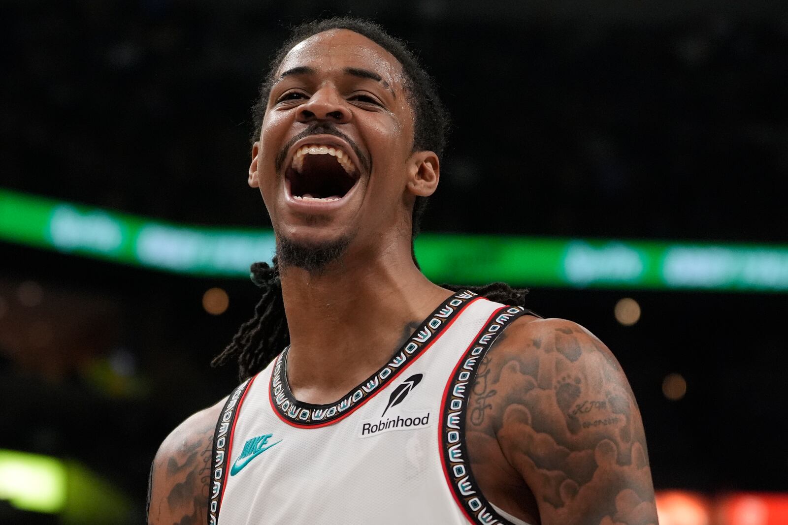 Memphis Grizzlies guard Ja Morant celebrates during the second half of an NBA play-in tournament basketball game against the Dallas Mavericks, Friday, April 18, 2025, in Memphis, Tenn. (AP Photo/George Walker IV)