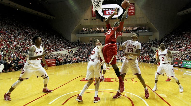 BLOOMINGTON, IN - DECEMBER 28: Jordy Tshimanga #32 of the Nebraska Cornhuskers attempts a layup over Zach McRoberts #15 of the Indiana Hoosiers in the first half at Assembly Hall on December 28, 2016 in Bloomington, Indiana. (Photo by Dylan Buell/Getty Images)