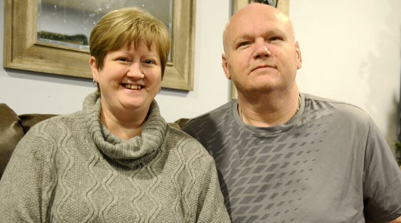 Keli Thorn, left, is in need of a new kidney, and her husband, Aaron, has been spreading the word about his wife’s need on social media and out around Butler County. Keli was diagnosed with polycystic kidney disease, a genetic kidney disease she had before her 2009 diagnosis. Pictured are Keli and Aaron in the Fairfield Twp. home on Dec. 31, 2019. MICHAEL D. PITMAN/STAFF