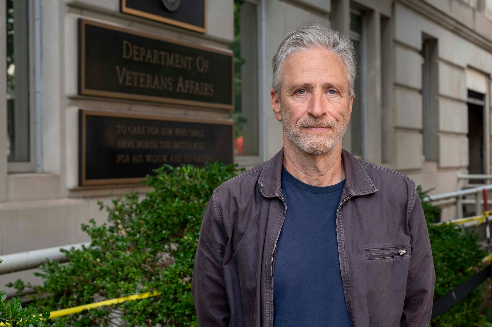 Jon Stewart poses for a photo outside the Department of Veterans Affair following an interview on Friday, July 26, 2024, in Washington. (AP Photo/Kevin Wolf)