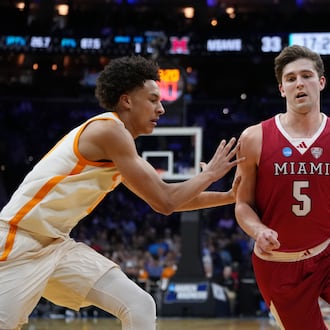 Miami (Ohio)'s Peter Suder, right, tries to get past Tennessee's Nate Ament during the second half in the first round of the NCAA college basketball tournament, Friday, March 20, 2026, in Philadelphia. (AP Photo/Matt Slocum)