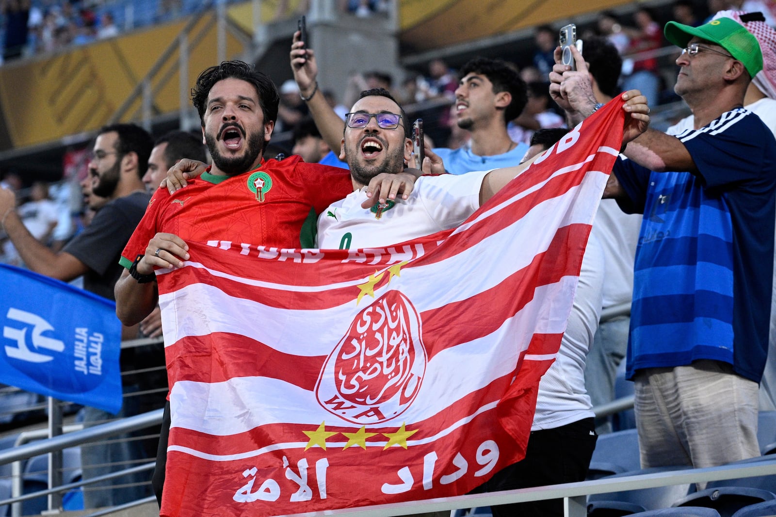 Fans cheer before the Club World Cup round of 16 soccer match between Manchester City and Al Hilal in Orlando, Fla., Monday, June 30, 2025. (AP Photo/Phelan Ebenhack)