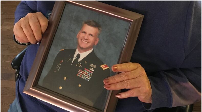 Rosaland Jackson of Middletown holds a photo of her son, Army Lt. Col. Joe Jackson.