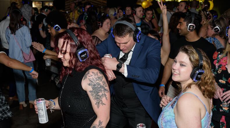 Dayton Silent Disco celebrates its third anniversary Friday, April 26 at Yellow Cab Tavern in downtown Dayton. TOM GILLIAM / CONTRIBUTING PHOTOGRAPHER