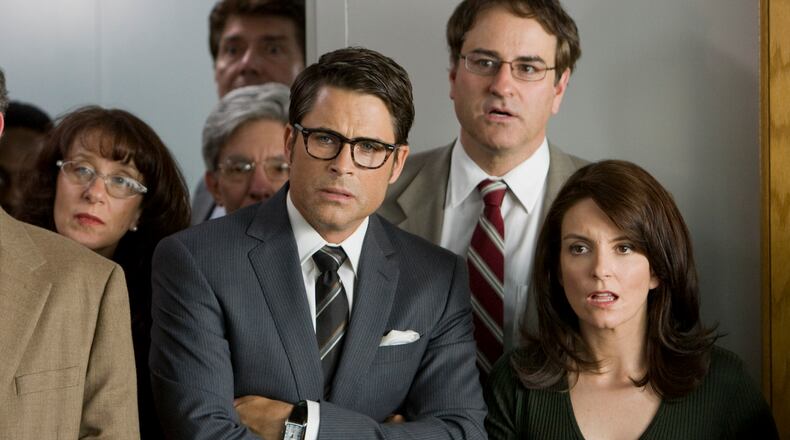 In this film publicity image released by Warner Bros., Rob Lowe, and Tina Fey, right, are shown in a scene from, "The Invention of Lying." (AP Photo/Warner Bros., Sam Urdank)