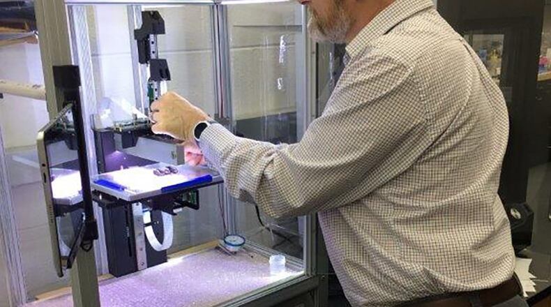 Dr. Hilmar Koerner of the Air Force Research Laboratory was elected to the 2019 Class of the American Chemical Society of Fellows. He uses a 3D printer to print epoxy carbon fiber reinforced inks. (U.S. Air Force photo/Donna Lindner)