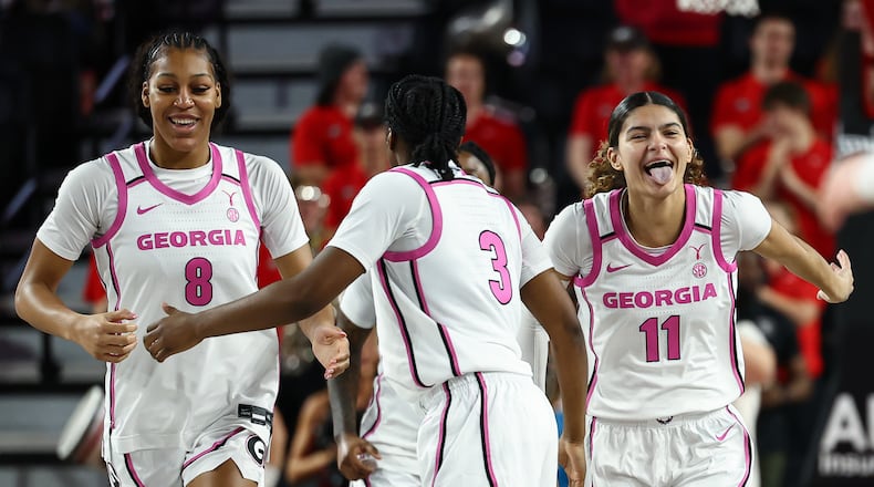 Georgia forward Zhen Craft (8) and guards Dani Carnegie (3) and Enjulina Gonzalez (11) react during the first half of an NCAA college basketball game against Vanderbilt, Sunday, Feb. 15, 2026, in Athens, Ga. (AP Photo/Colin Hubbard)