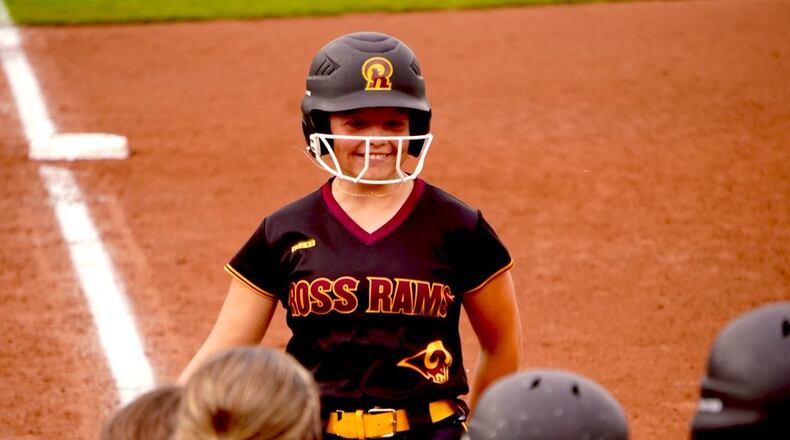 Ross freshman Mia Michel is greeted by teammates at home plate after hitting a two-run homer against Western Brown in a Division III regional semifinal on Wednesday at Miami University. CHRIS VOGT / CONTRIBUTED