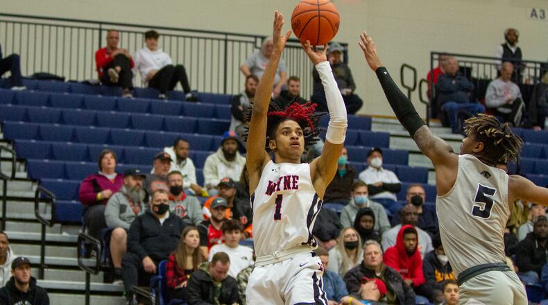 Wayne’s Lawrent Rice shoots over Pickerington North’s Dior Conners during the first half of Saturday’s Flyin’ To The Hoop game at Trent Arena. Jeff Gilbert/CONTRIBUTED