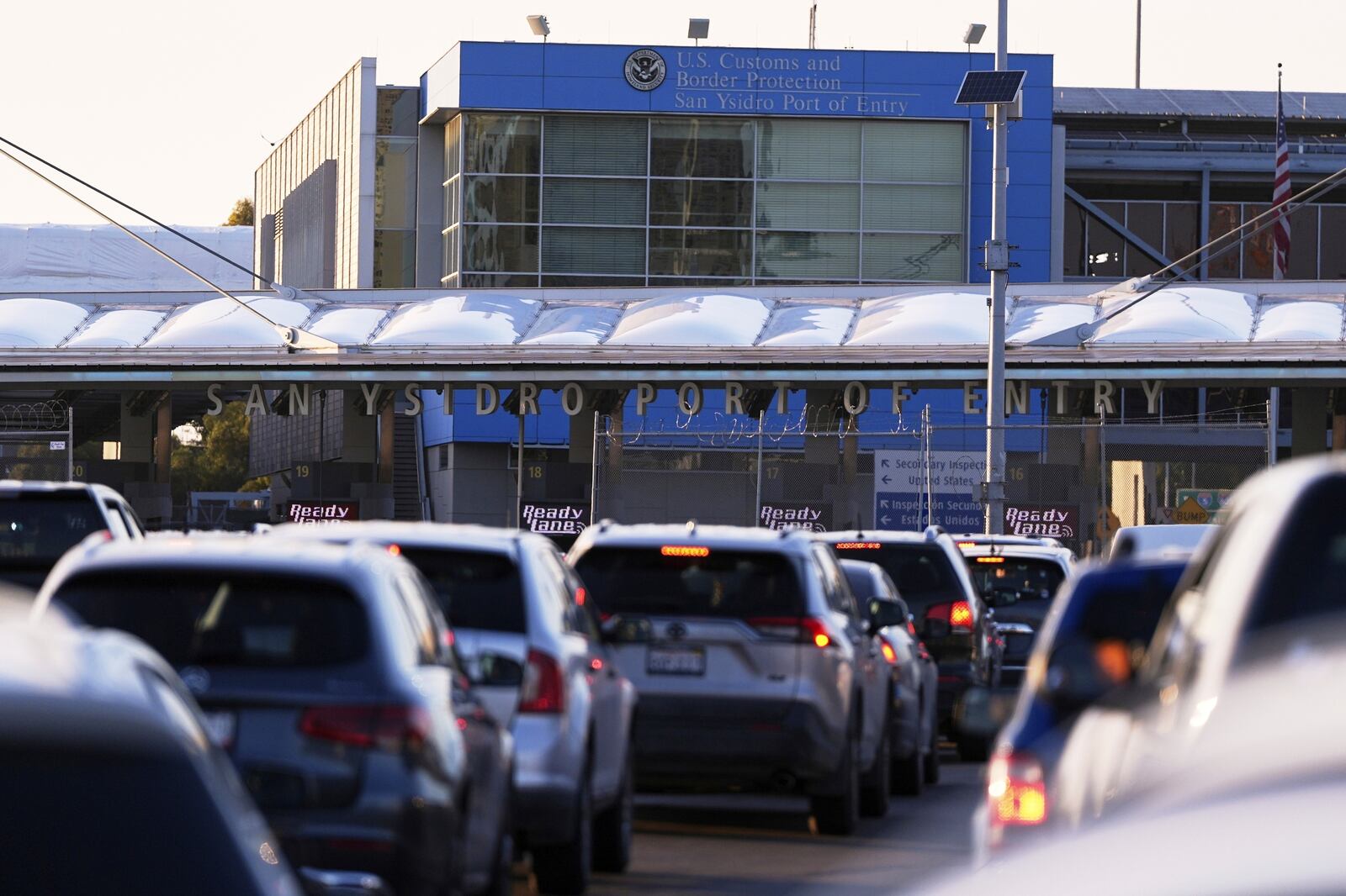 FILE - Vehicles wait in line to cross the border into the United States at the San Ysidro Port of Entry, March 18, 2025, in Tijuana, Mexico. (AP Photo/Gregory Bull, File)