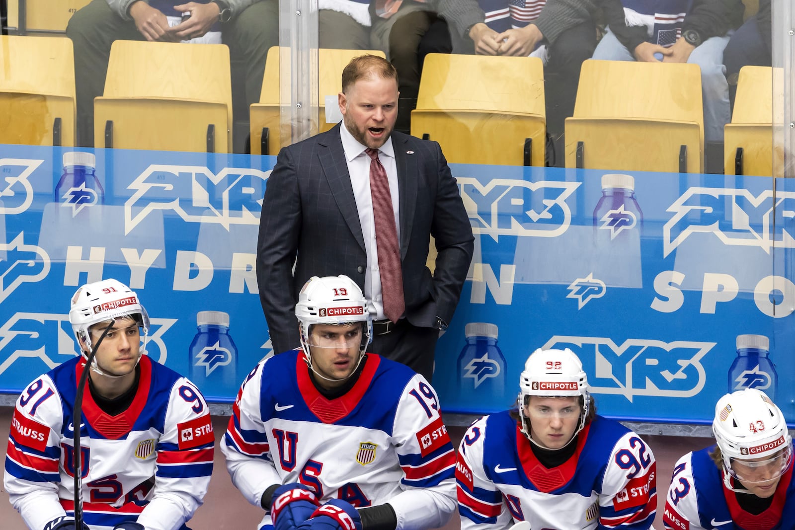 Ryan Warsofsky, head coach of USA national ice hockey team looks on, during the IIHF 2025 World Championship preliminary round group B game between Kazakhstan and USA, at the Jyske Bank Boxen, in Herning, Denmark, Sunday, May 18, 2025. (Salvatore Di Nolfi/Keystone via AP)