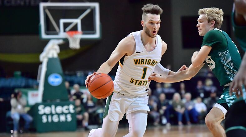 Wright State’s Bill Wampler looks to drive past Green Bay’s Hunter Crist at the Nutter Center on Saturday, Dec. 28, 2019. Joseph Craven/WSU Athletics