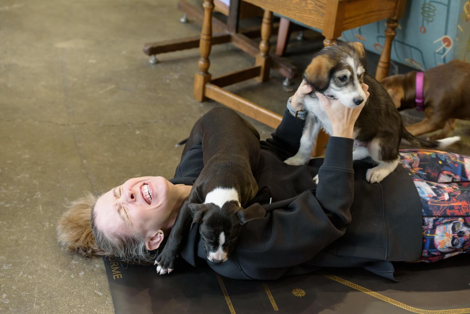 PHOTOS: Puppy Yoga with Adopt a Pit at Base Camp Outdoors Co. in downtown Dayton